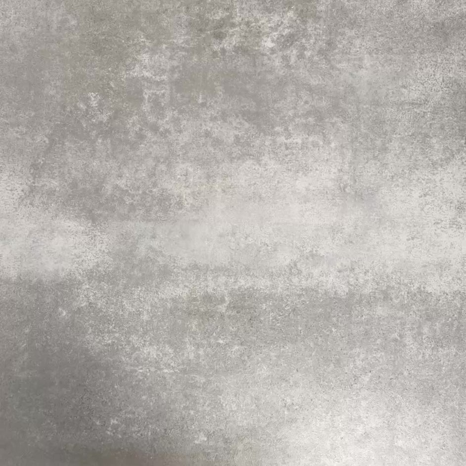 Video showcasing Fez Mini Artisan 15x15cm Moroccan-style porcelain tile displayed against a textured grey background, highlighting the intricate multicolour geometric star pattern in soft blue, blush pink, green and terracotta tones with an encaustic-inspired finish.