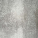 Product display of Pottery Brick Blanco 5x25cm glossy wall tiles in soft white tones, featuring handcrafted edges and subtle surface variation, shown against a textured concrete-style backdrop.
