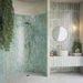 Bathroom setting featuring Jumairah Almond Nut and Jumairah Aqua Green 5x40cm gloss wall tiles, installed in a vertical layout, showcasing warm neutral and soft green tones, paired with contemporary fittings and a clean, modern interior.