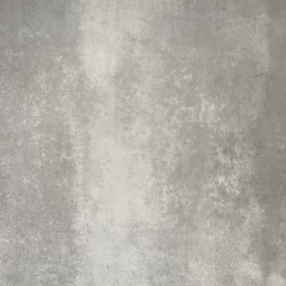 Video showcasing Fez Mini Jade Green 15x15cm Moroccan-style porcelain tile displayed against a textured grey background, highlighting the soft jade green and white geometric star pattern with an encaustic-inspired finish.