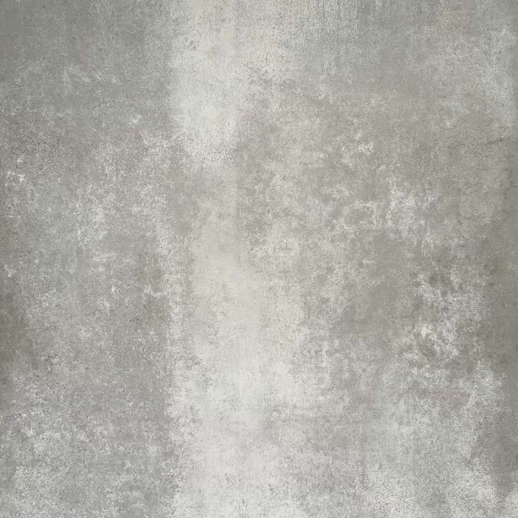 Video showcasing Zellige Rose Pink Square 13.2 × 13.2cm Moroccan-style ceramic tiles in soft blush, dusty rose and warm pink tones, showing subtle shade variation and gently uneven edges, being arranged in a simple grid on a textured grey background to highlight the handcrafted zellige-effect surface.