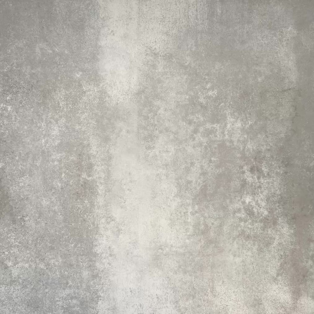 Video showcasing Cuba Fleur de Lis Moroccan-style porcelain tiles in a 20×20cm square format, arranged in a repeating decorative pattern featuring soft green and white detailing, and classic encaustic-style design.