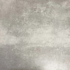 Video showcasing Fez Mini Springs 15x15cm Moroccan-style porcelain tiles arranged as a four-tile panel, highlighting the full repeat design with layered blue and soft green geometric star motifs against a textured grey background.