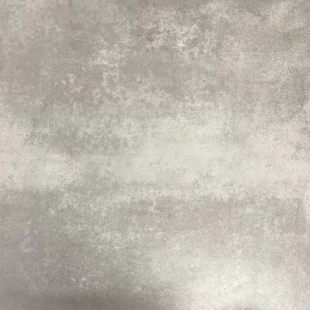 Video showcasing Fez Autumn Moroccan-style porcelain tiles, showing how the 20 × 20cm tiles come together to form a complete geometric motif. The design features soft blush-pink floral shapes, deep green leaf-like details and a charcoal background, creating a balanced, symmetrical pattern inspired by traditional Moroccan encaustic tiles.